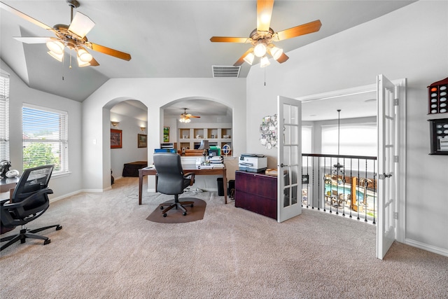 office with vaulted ceiling, light carpet, and ceiling fan