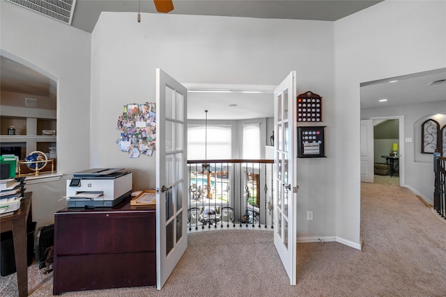 office space with french doors and light colored carpet