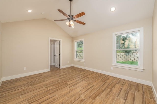 spare room featuring lofted ceiling and ceiling fan