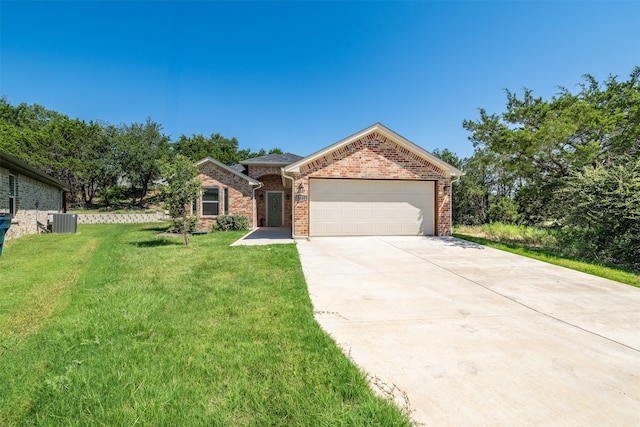 ranch-style home with a garage, a front yard, and central AC unit