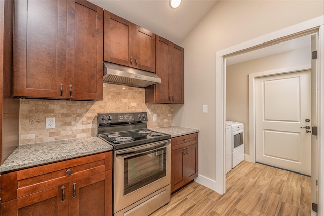 kitchen featuring light stone countertops, decorative backsplash, vaulted ceiling, stainless steel range with electric cooktop, and light wood-type flooring