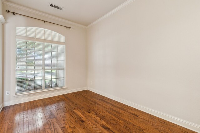 unfurnished living room with built in shelves, a high ceiling, dark hardwood / wood-style flooring, crown molding, and a fireplace