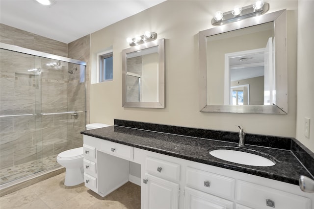 bathroom featuring walk in shower, tile patterned floors, toilet, and vanity