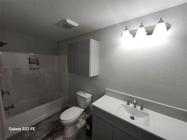 5280 Atwell Ln, Denton, TX 76208 - bathroom with toilet, vanity, a textured ceiling, and bathing tub / shower combination