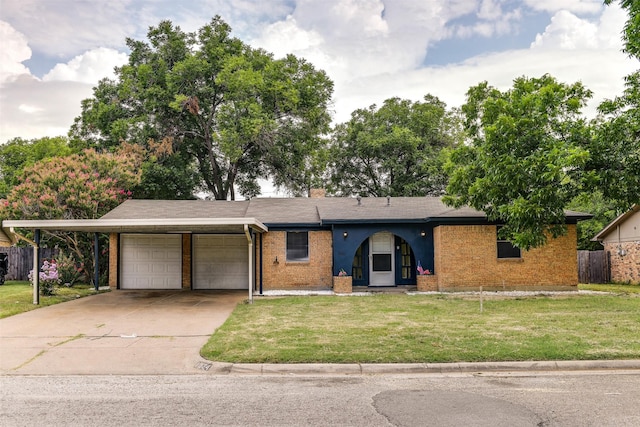 ranch-style house featuring a front yard and a garage