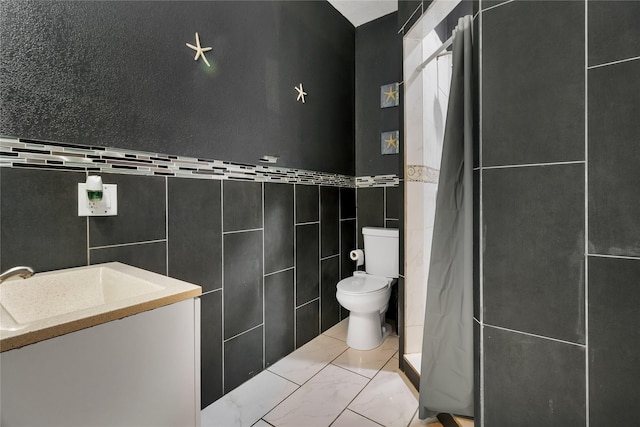 bathroom featuring vanity, a shower with shower curtain, tile walls, and toilet