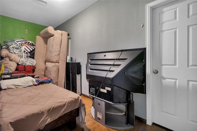 bedroom with wood-type flooring