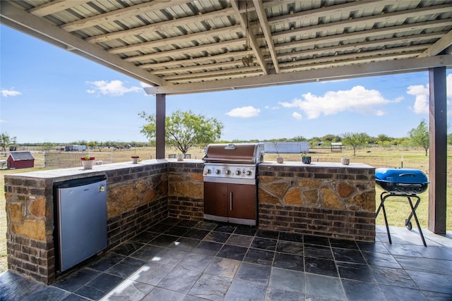 view of patio / terrace featuring grilling area and a balcony