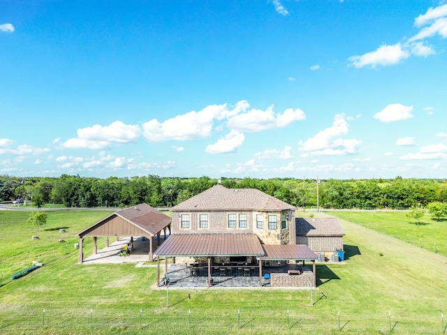 rear view of property featuring a rural view