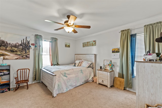 bedroom featuring crown molding, light colored carpet, and ceiling fan