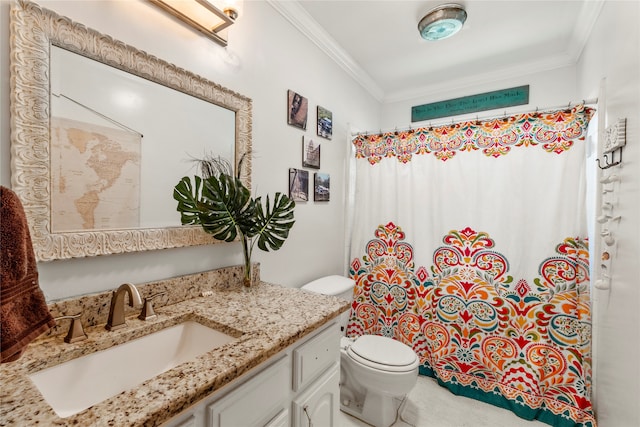 bathroom featuring vanity, crown molding, and toilet