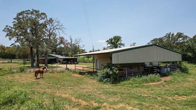 view of outdoor structure with a rural view