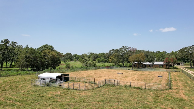 view of yard with a rural view