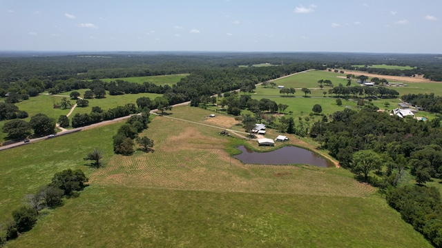 drone / aerial view with a rural view and a water view