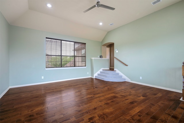 unfurnished living room featuring ceiling fan, dark hardwood / wood-style floors, and lofted ceiling