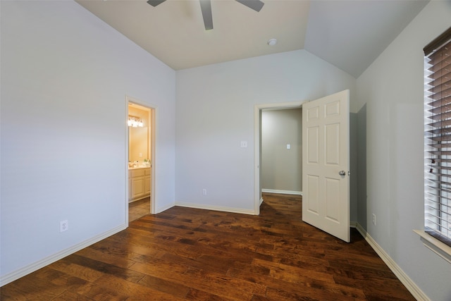 unfurnished bedroom featuring dark hardwood / wood-style floors, vaulted ceiling, ceiling fan, and ensuite bathroom