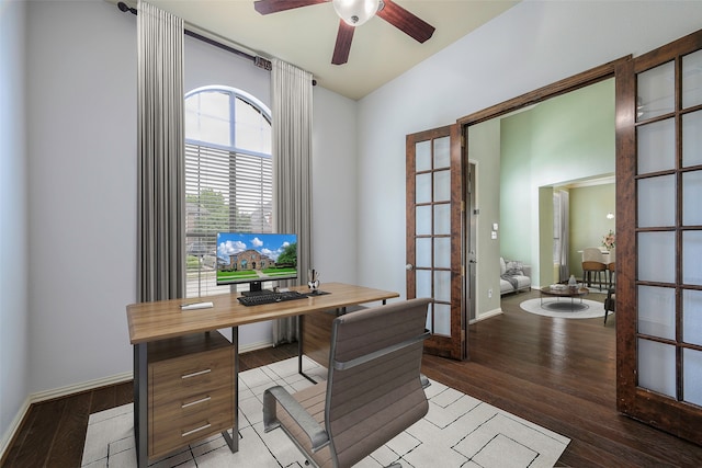 home office with ceiling fan, light hardwood / wood-style flooring, and french doors