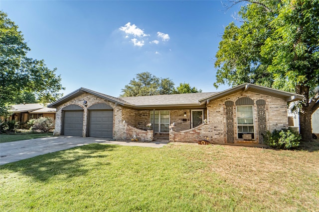 ranch-style home with a garage and a front yard