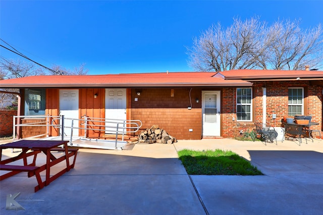 ranch-style house with a patio area