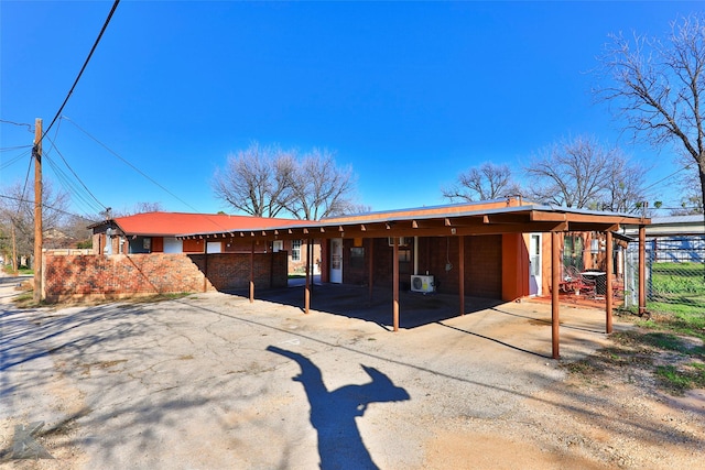 view of front of property with fence and driveway