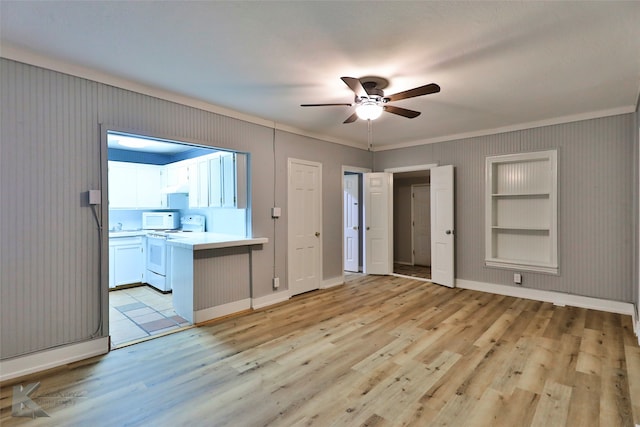 interior space featuring light wood-type flooring and ceiling fan