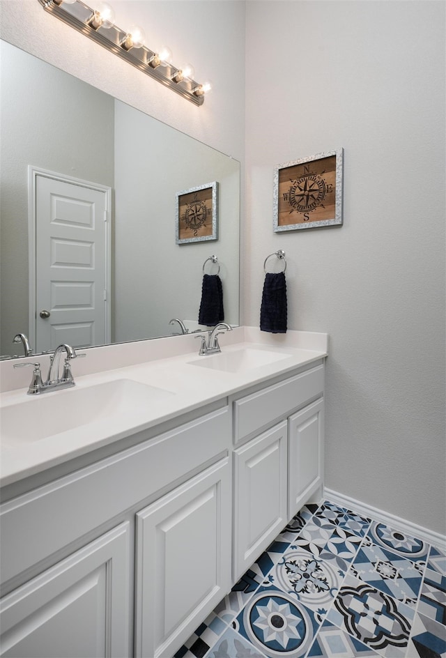 bathroom with tile patterned flooring and dual bowl vanity