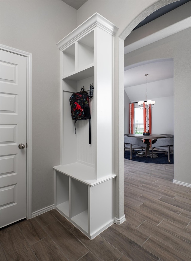 mudroom featuring a chandelier and dark hardwood / wood-style floors