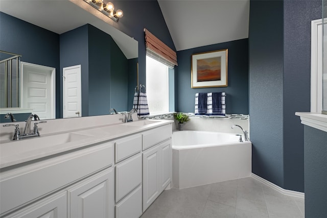 bathroom featuring tile patterned floors, dual vanity, vaulted ceiling, and a tub