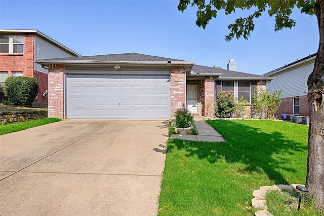 view of front of home featuring a garage and a front yard