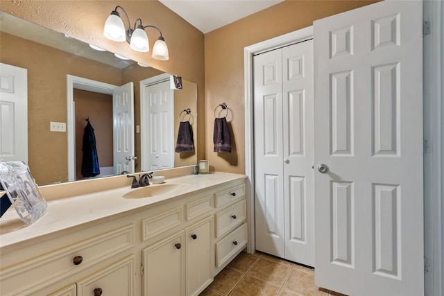 bathroom with vanity and tile patterned flooring