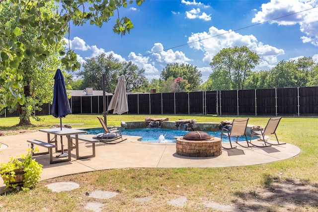 view of swimming pool with a patio, a lawn, and a fire pit