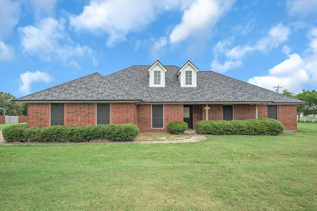 view of front of property with a front lawn