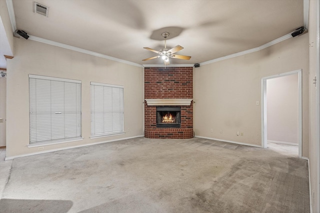 unfurnished living room with light carpet, ceiling fan, crown molding, and a fireplace