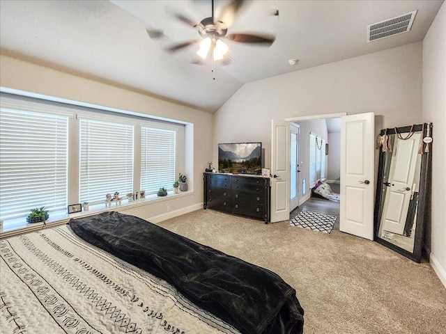 carpeted bedroom with ceiling fan and lofted ceiling