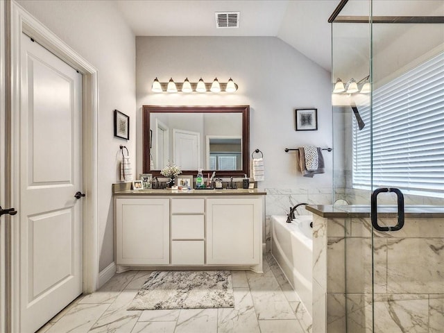 bathroom with shower with separate bathtub, vanity, and vaulted ceiling