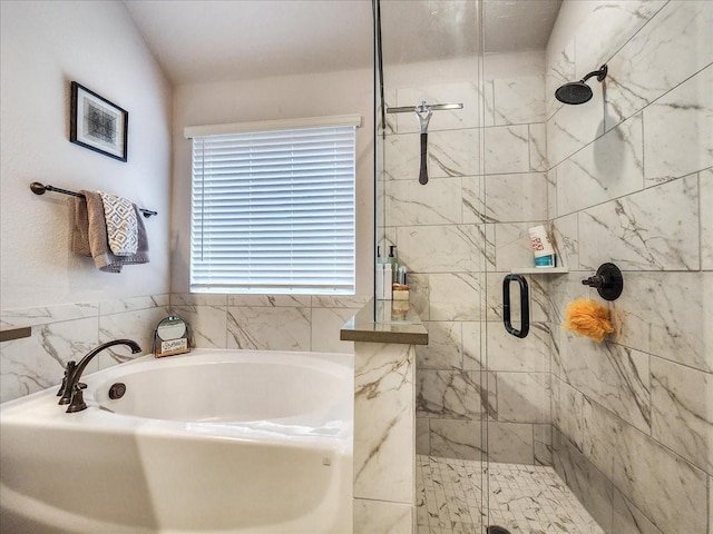 bathroom featuring plus walk in shower and a wealth of natural light