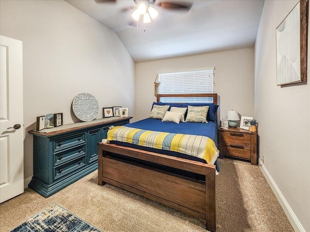 bedroom with carpet, vaulted ceiling, and ceiling fan