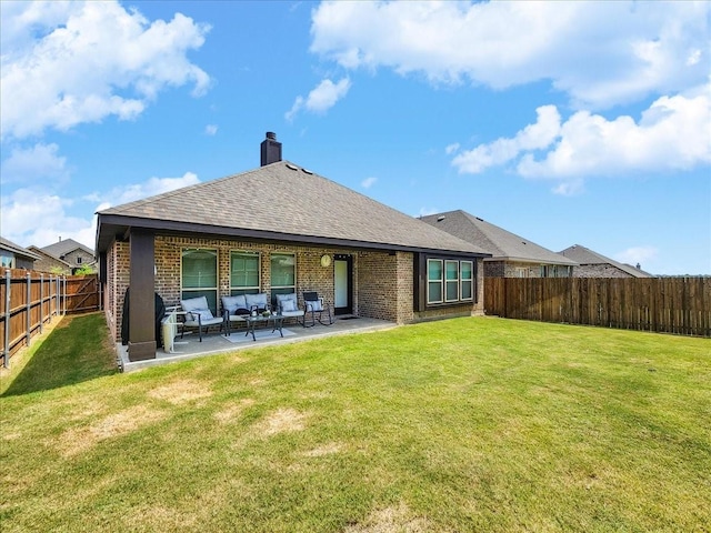 rear view of house with an outdoor hangout area, a patio, and a lawn