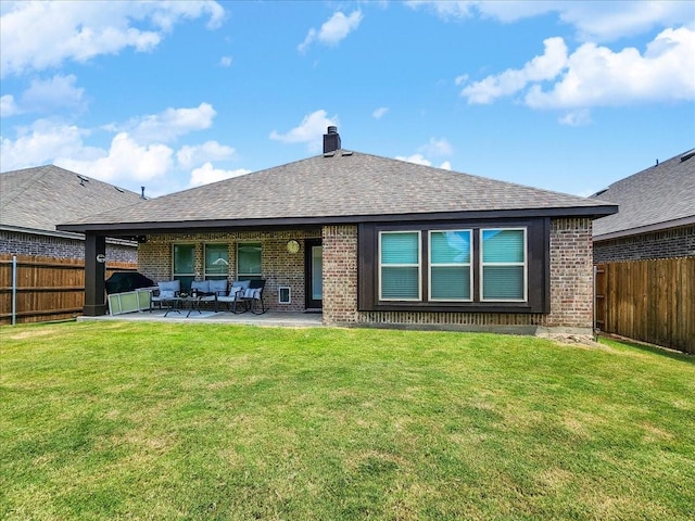 back of house with an outdoor living space, a patio area, and a yard