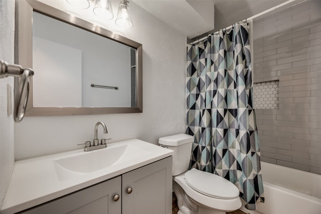 full bathroom featuring vanity, shower / bathtub combination with curtain, and toilet