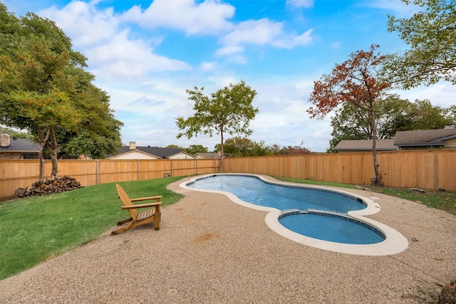 view of pool with an in ground hot tub