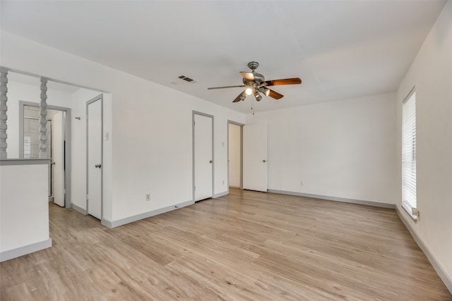 unfurnished room with light hardwood / wood-style flooring and ceiling fan