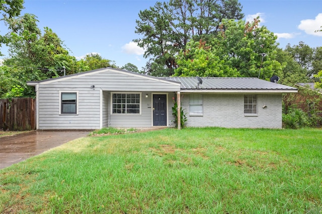 ranch-style home with a front lawn