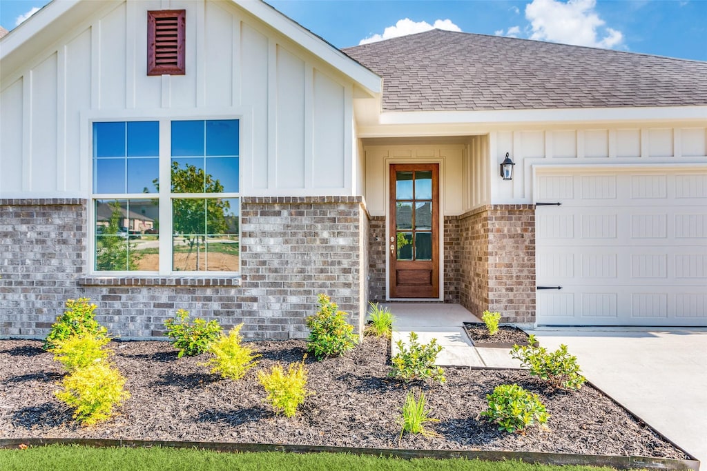 doorway to property featuring a garage