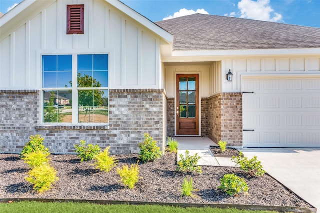 doorway to property featuring a garage