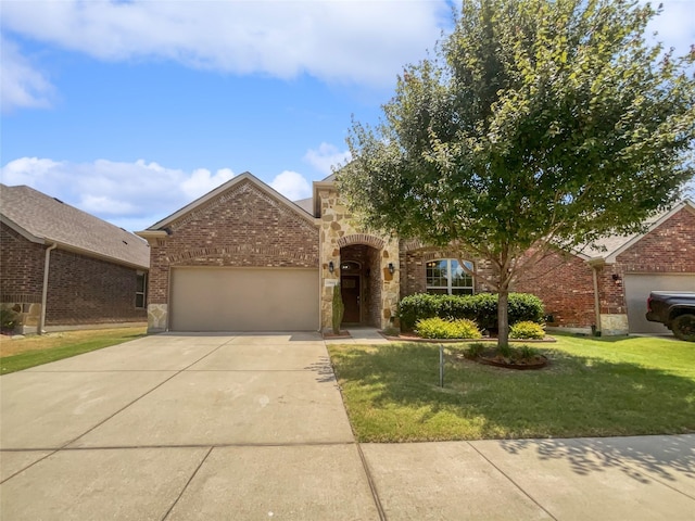 view of front of house featuring a front yard and a garage