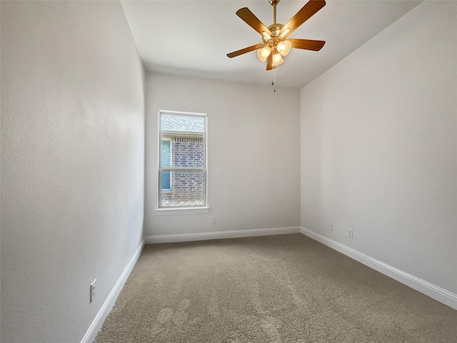 spare room with ceiling fan and carpet floors