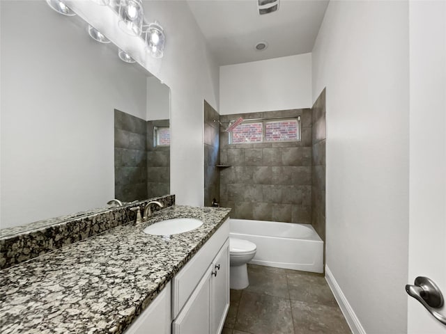 full bathroom with vanity, toilet, and tiled shower / bath