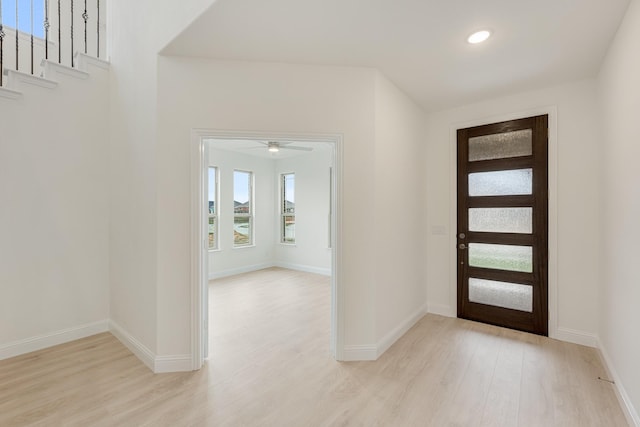 entrance foyer with light hardwood / wood-style flooring