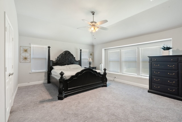 carpeted bedroom with lofted ceiling and ceiling fan